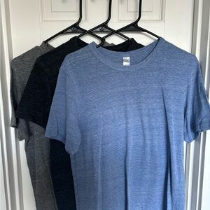 Alternative T shirt bundle. Light blue, dark grey, and light grey.